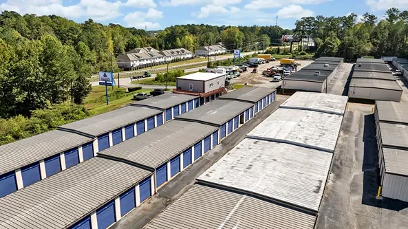 Drive-up storage units with central office building and easy access layout